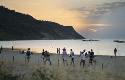 Beachcombers at the Lido Pavarotti in Pesaro