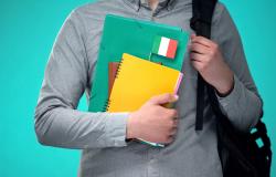 Student holding notebooks with Italian flag, international educational program