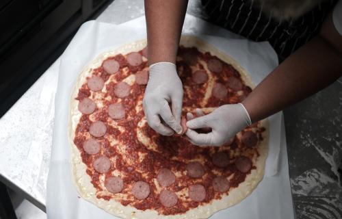 Preparation of a New York-style pizza